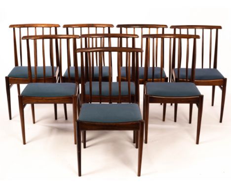 Style of Arne Vodder, a set of eight rosewood dining chairs, mid Century, with curved toprail, spindle back and upholstered s