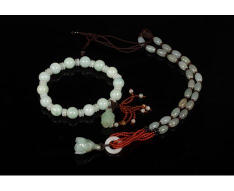 A jade bead bracelet, a similar necklace and three costume necklaces, etc.