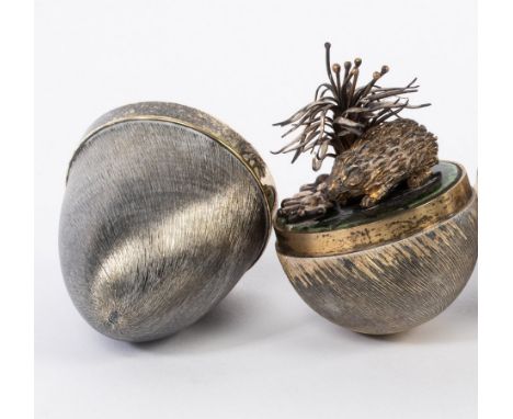 Stuart Devlin (1931-2018), a silver, silver gilt and enamel surprise egg, London 1978 of textured form, containing a hedgehog