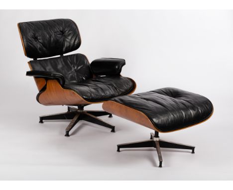 Charles and Ray Eames for Herman Miller, a model 670 lounge chair, veneered rosewood with buttoned black leather upholstery o