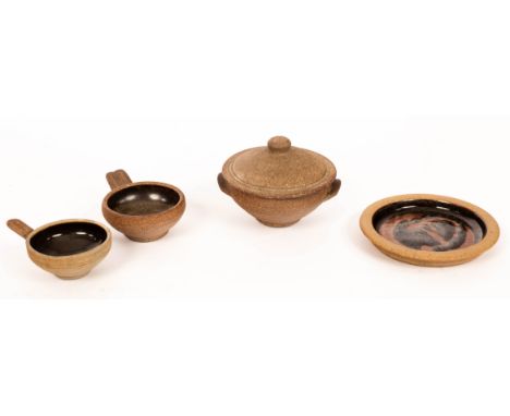 Bernard Leach (1887-1979), a Muchelney tenmoku glaze plate, 15.5cm diameter, a Leach Pottery lidded soup bowl, 15cm diameter 