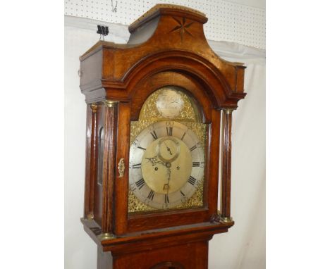 An 18th Century longcase clock by Thomas Smith of Norwich with 12" brass and silvered arched dial, 8-day movement in inlaid o