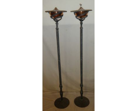 A pair of modern painted metal and copper uplighting oil lamp standards with fluted columns and circular bases