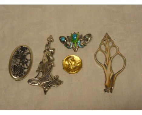 A silver Art Nouveau-style dress brooch in the form of a female with flowing dress, London marks; four other various dress br