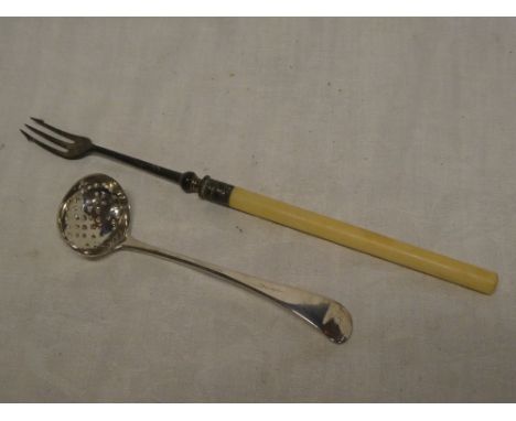 A George III silver sifting ladle, Birmingham marks 1811 and a silver mounted pickle fork with ivory handle (2)