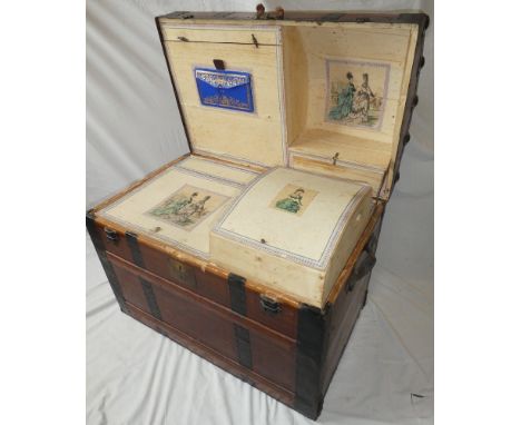 An ornate 19th Century Saratoga travelling trunk, the domed hinged lid revealing numerous fitted compartments with applied fa