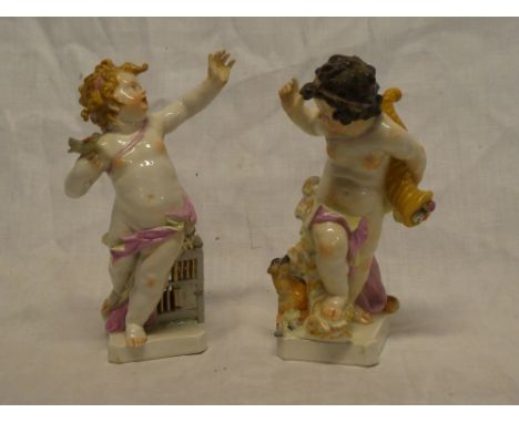 A pair of 19th Century Continental china Putti figures, 8" high