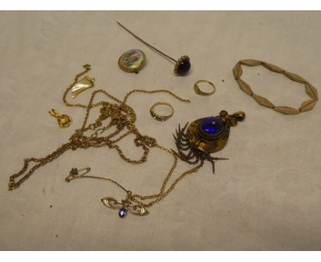 A selection of various costume jewellery including necklaces, decorative pendant, stick pin, etc