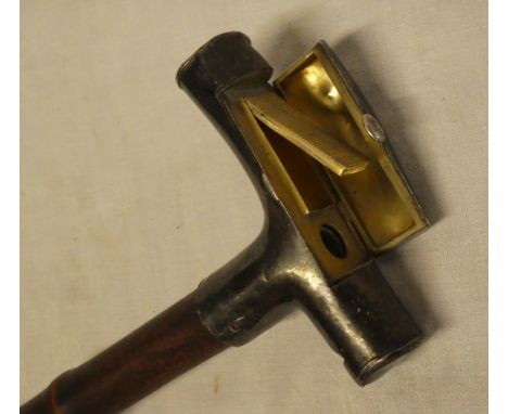 An unusual Victorian silver topped walking stick, the handle opening to reveal an inset hinged vesta case with striker, the e