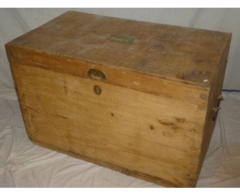 A large pine rectangular travelling trunk with iron ring handles and brass name plate named to J H Barber from Bilney and Ash