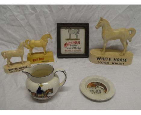 Three various White Horse Scotch Whiskey advertising figures, similar framed plaque; a Reid's Stout advertising ash tray and 