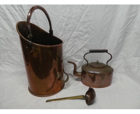 A Victorian copper oval kettle with scroll handle, old brass and copper ladle and a copper cylindrical coal bucket (3)