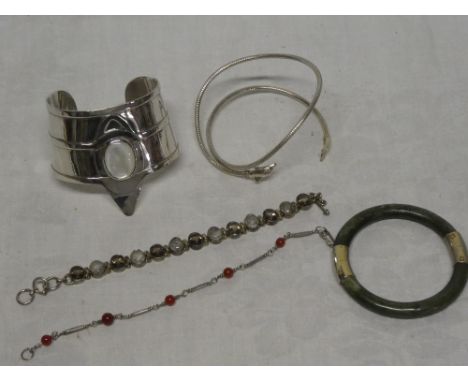 A .925 standard silver bangle set mother of pearl, various other bracelets and bangles, etc
