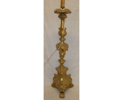 A good quality gilt painted wood table lamp with raised scroll decoration on trefoil base