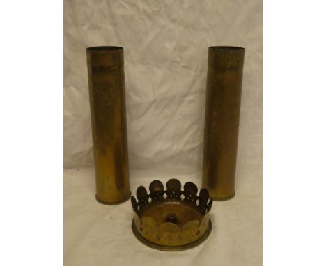 A First War brass shell case bowl marked  "Magdeburg 1916" and a pair of First War brass shell cases with engraved floral dec