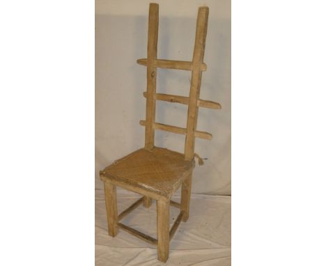 An unusual Continental rustic pine ladder back chair with rattan seat on square legs