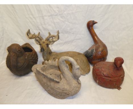 A selection of various figures including terracotta pelican jardiniere, composition swan bowl, resin figure of a stag, wooden