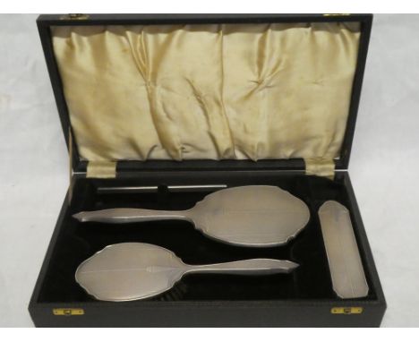 An George VI silver four piece dressing set comprising hand mirror, hair brush, clothes brush and comb, Birmingham marks 1950
