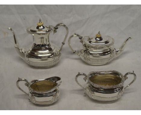 A good quality silver plated four-piece tea and coffee set comprising rectangular coffee pot with raised decoration and ivory