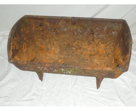 An old cast iron rectangular feeding trough, 24½" long