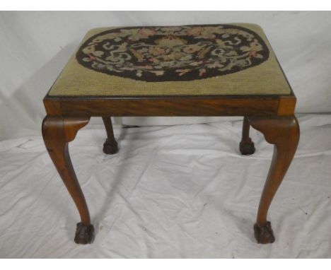 A beechwood rectangular stool with tapestry floral seat on cabriole legs