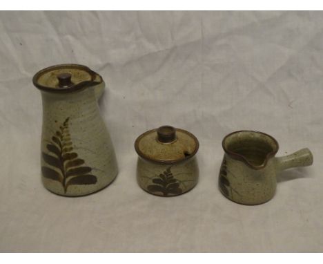 A 1960s Leach pottery tapered single handed coffee pot and cover with painted leaf decoration together with matching circular