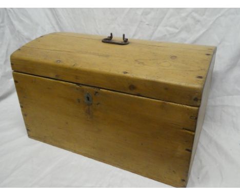 A small polished pine domed travelling trunk with hinged lid, 23" long