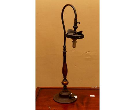 Copper table lamp converted to electricity in mid 20thC retaining original Victorian gas light fitting. Weighted base. No wir