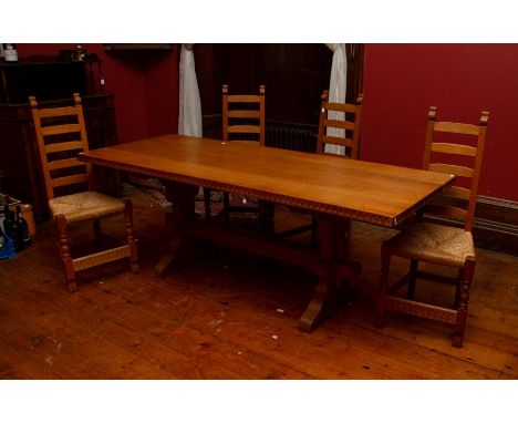 A Rupert Griffiths joined oak dining room suite, comprising a plank topped dining table and eight chairs, the chairs includin