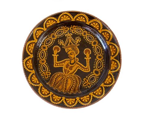 A large medieval style ceramic charger. Diameter 50cm