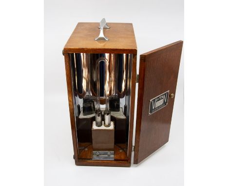 The Thermal Syndicate ‘Vi-tan’  vapour lamp, mid-1930s Oak, chromium plating, and quartz glass. Original flex and plugs.  Unm