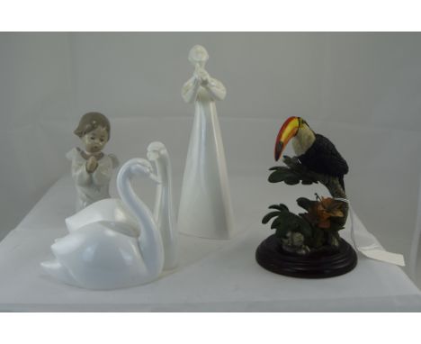 A Small Collection of Ceramic Figures ( 4 ) In total. 1/ Coalport Moments Bone China figure - together / Forever Swans. 2/ Ro