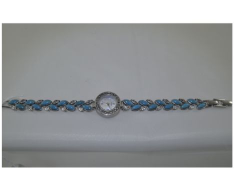 A Silver and Turquoise Set Ladies Wrist Watch with Mother of Pearl Dial and Crystal Set Bezel. The Turquoise with Crystal Spa