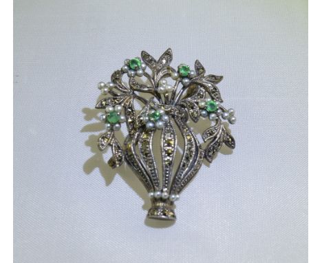 Emerald, Seed Pearl and Marcasite 'Forget-Me-Not' Brooch/Pendant, an openwork vase holds sprigs of white seed pearl flowers, 