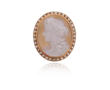 A Victorian carved hardstone cameo brooch, depicting Dionysus in profile, within seed pearl border set in yellow gold, 5cm hi