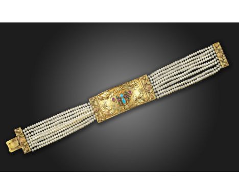 A Regency gold butterfly bracelet, the rectangular tri-colour gold bangle is decorated with a butterfly set with turquoise, r
