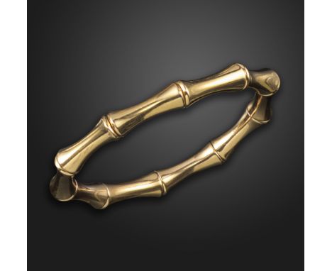 A gold 'bamboo' bangle by Gucci, the expanding bracelet with polished gold links in the form of bamboo, signed Gucci, Italian