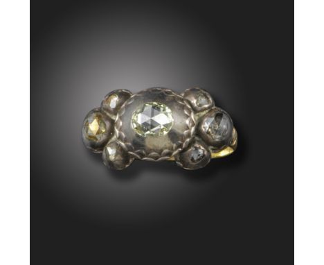 A mid 17th century diamond and enamel ring, the seven graduated rose-cut diamonds in high-domed scallop-edged settings, with 