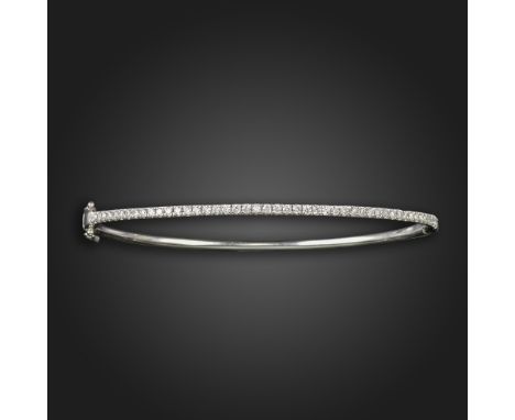 A diamond-set white gold bangle, half pavé-set with round brilliant-cut diamonds, diamonds 0.50cts total approximately, 5.8cm
