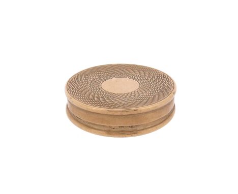 A circular 9ct gold pill box, with engine turned decoration and hinged lid, 9ct London hallmarks for 1964, maker's mark C&amp