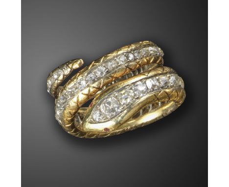 A diamond-set snake ring, the coiled snake body set with a line of graduated old cushion-shaped diamonds, with ruby eyes and 