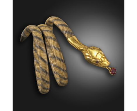 A late 19th century gold serpent bangle, the realistically formed snake with ruby eyes and a ruby suspended from its mouth, o