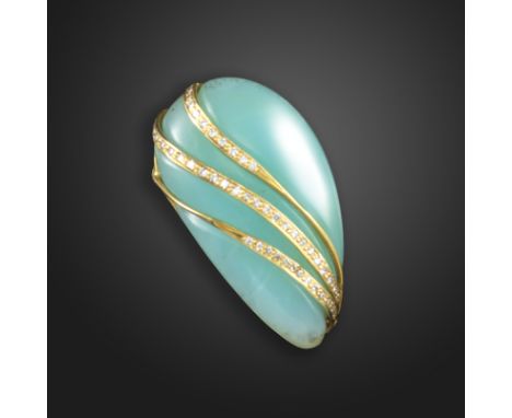 An opal and diamond ring by Geoffrey Rowlandson, the abstract carved blue common opal mounted with gold straps set with round