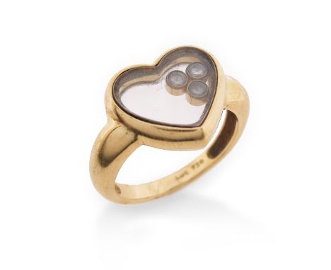 A 'Happy Diamonds' heart ring by Chopard, set with three diamonds in gold collets which move freely within the heart-shaped c