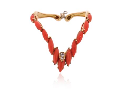 λ A coral and diamond-set bangle by David Morris, of chevron design, set with navette-shaped coral cabochons and two round br