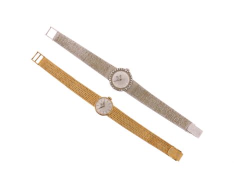 A lady's Jaeger LeCoultre gold wristwatch, the signed silver dial with diamond-set bezel on textured white gold band, manual 