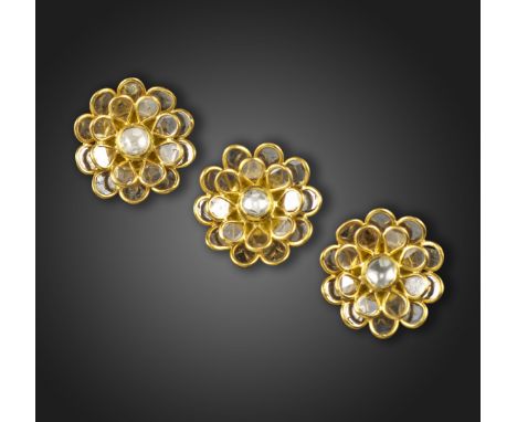 A suite of Indian diamond-set gold jewellery, comprising a pair of earrings and a pendant, of flowerhead form, the petals set