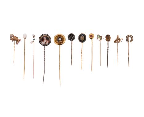A cased set of twelve stick pins, including a rose-cut diamond-set circular pin in silver on gold, a seed pearl-set horseshoe