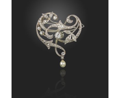 An Art Nouveau diamond brooch, set with graduated diamonds and suspending a seed pearl in platinum, detachable brooch fitting