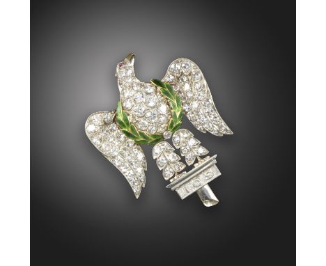 A diamond-set Regimental brooch for the 1st Royal Dragoons, the eagle set with circular-cut diamonds, with ruby eyes and gree